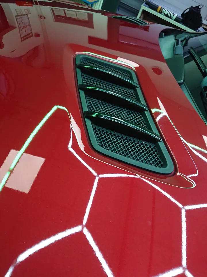 Red Mercedes-AMG with black-wrapped window trims and B-pillars – chrome package in black