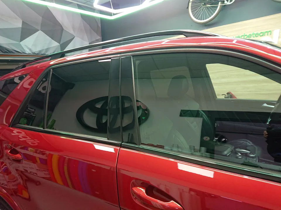 Black-wrapped bonnet vent louvres on a red Mercedes-AMG